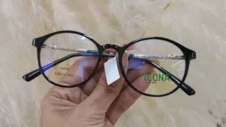 Montura redonda de acetato negro brillante con varillas de brillo plateado, para dama