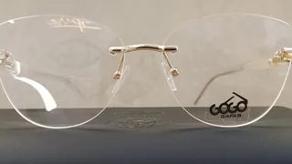 Montura de tres piezas sin aro con lentes estilo ojo de gato y puente dorado, para dama